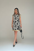 Black embroidered dress with intricate Persian detailing